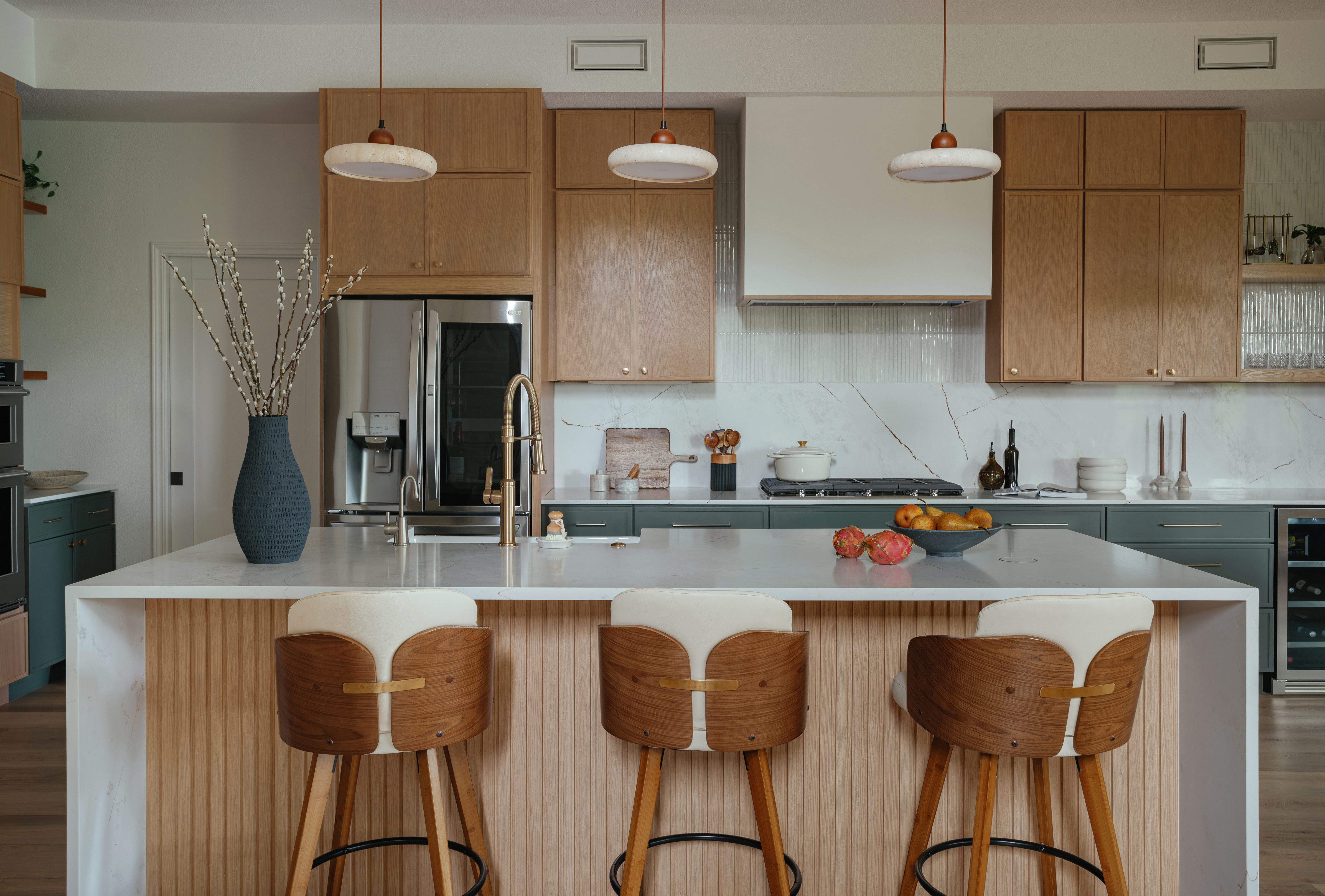 Kitchen island with walnut stools after the remodel