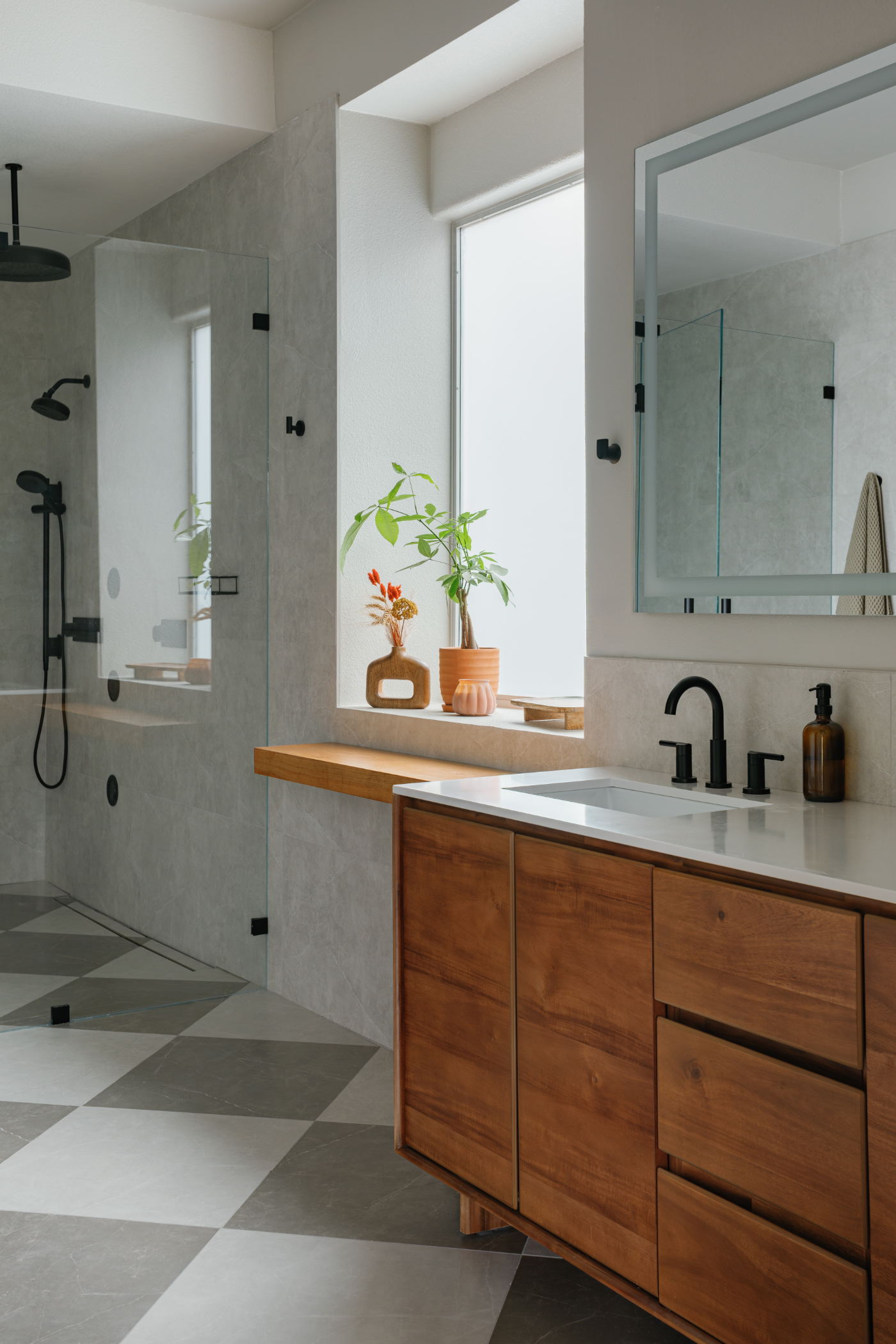 Bathroom with double vanity and checkered floor