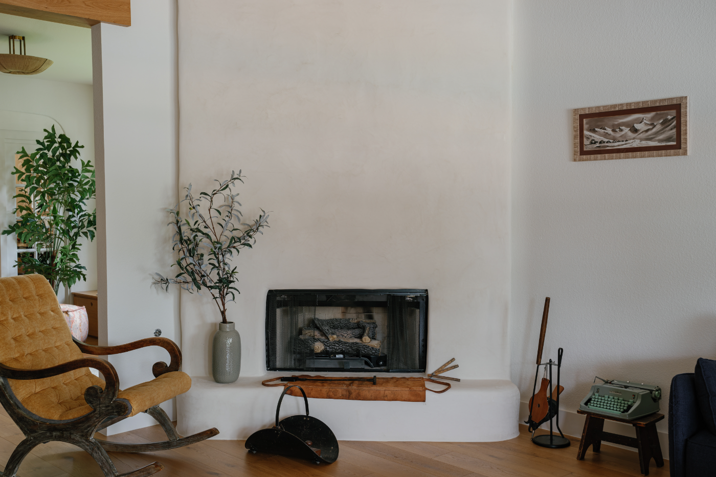 Plaster fireplace with rocking chair